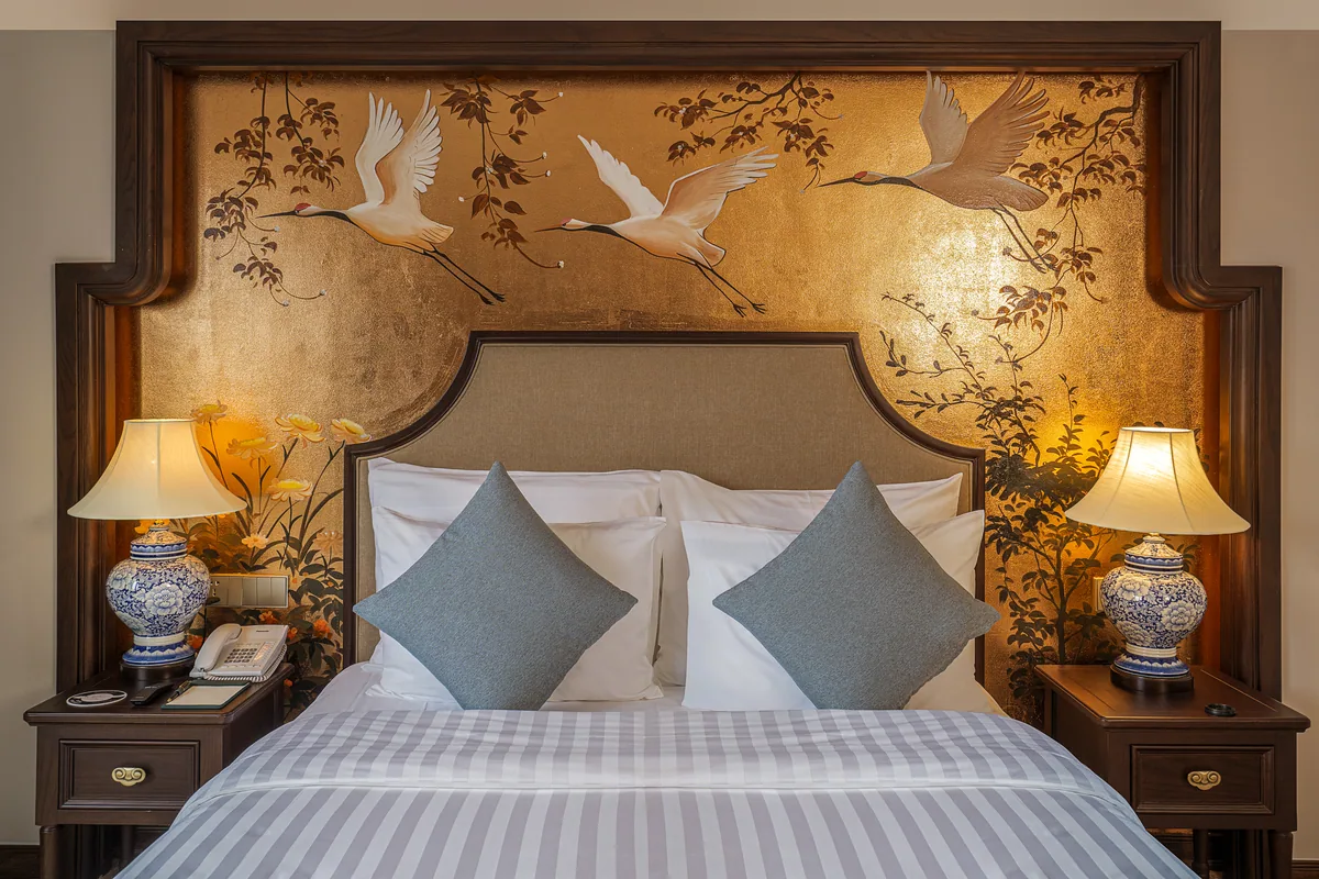 Hand painted headboard in a Premier room